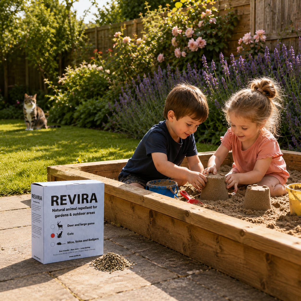 Children playing in a garden sandpit with a cat in the background and a box of Revira beside it.